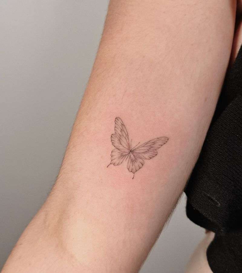 women-arm-butterfly-tattoo-minimalist