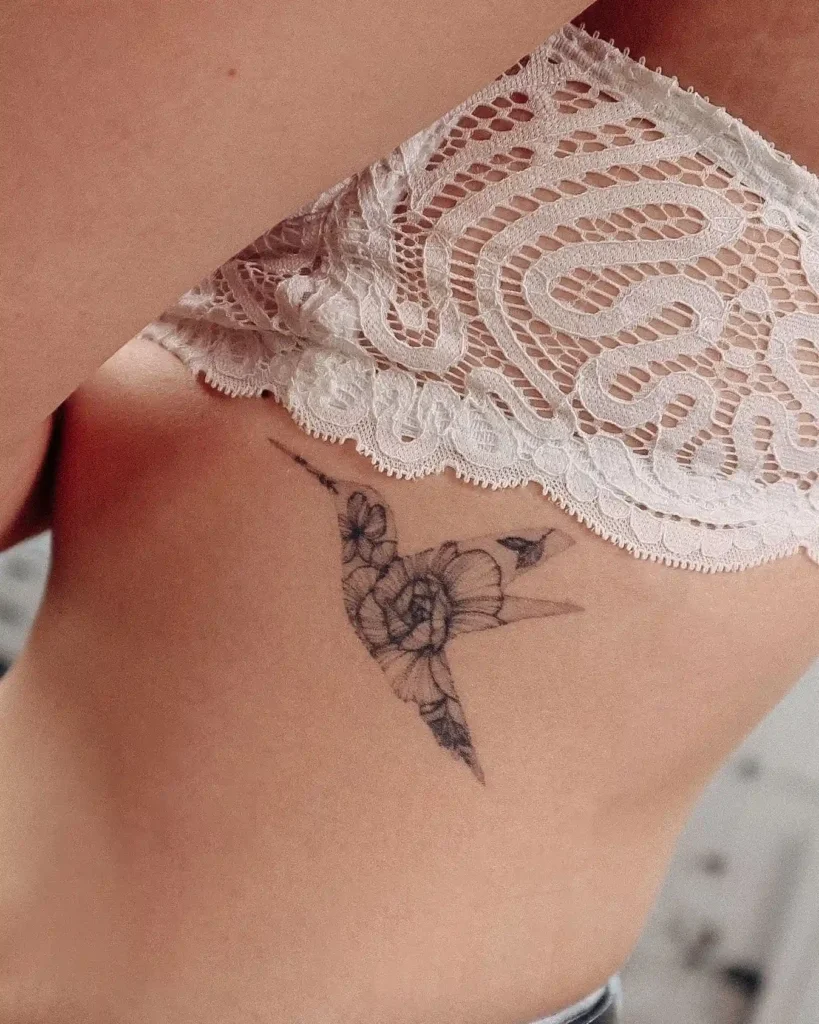 Small Floral Hummingbird Ribcage Tattoo