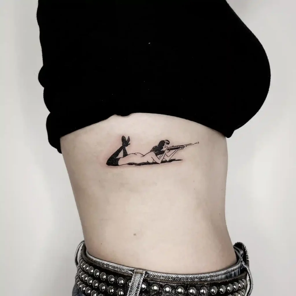 Female Sniper Rib Tattoo