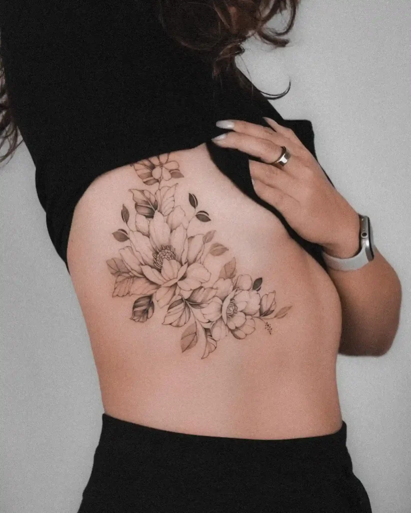 Magnolia Floral Cluster Ribcage Tattoo