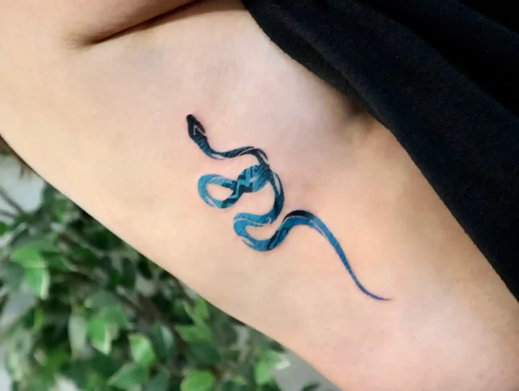 Blue Snake Ribcage Tattoo