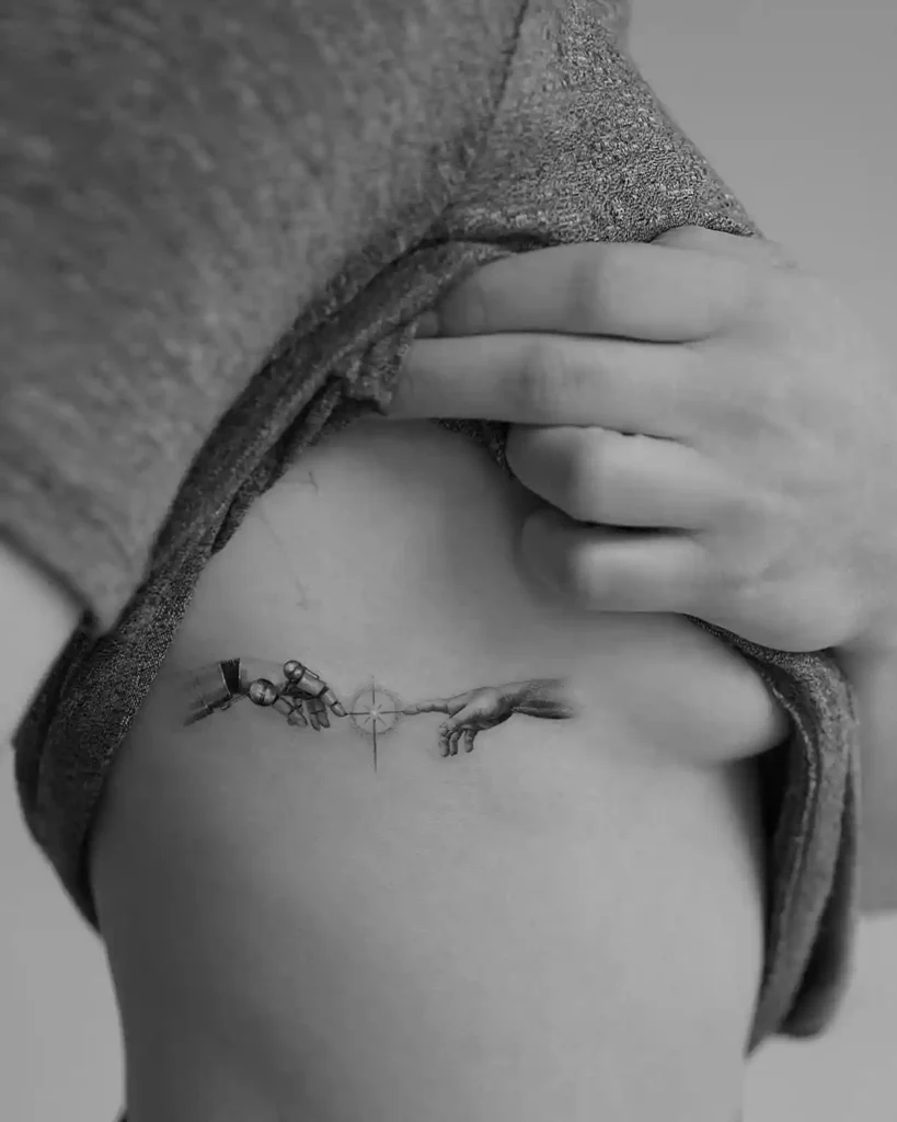 Robot and Human Hand Rib Tattoo