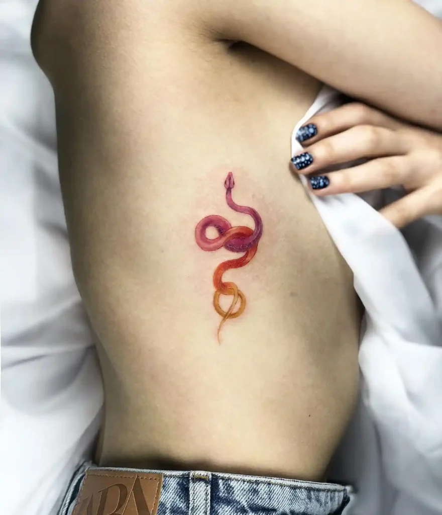 Pink and Orange Snake Ribcage Tattoo