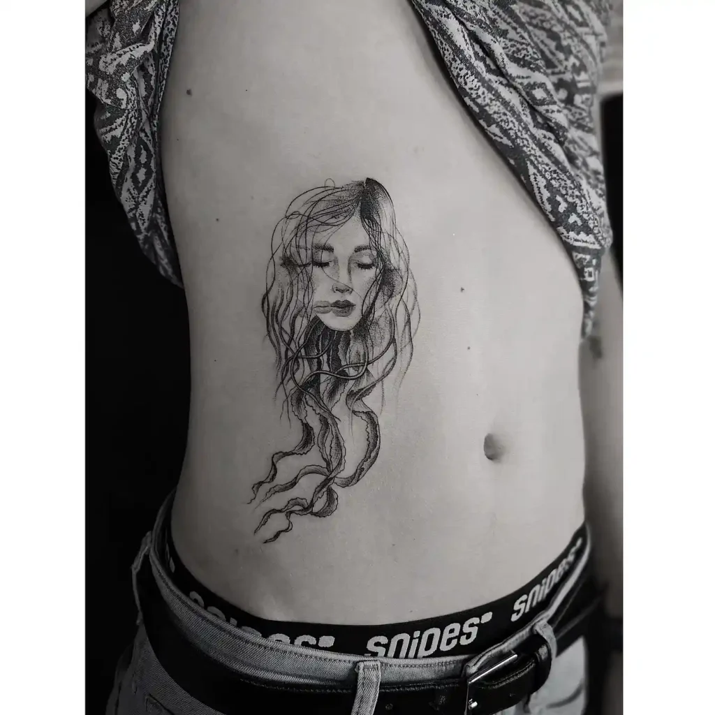 Surreal Women Face & Flowing Hair Ribcage Tattoo