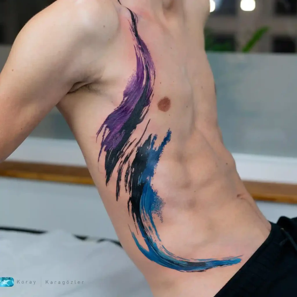 Abstract Vibrant Watercolor Swirl Ribcage Tattoo