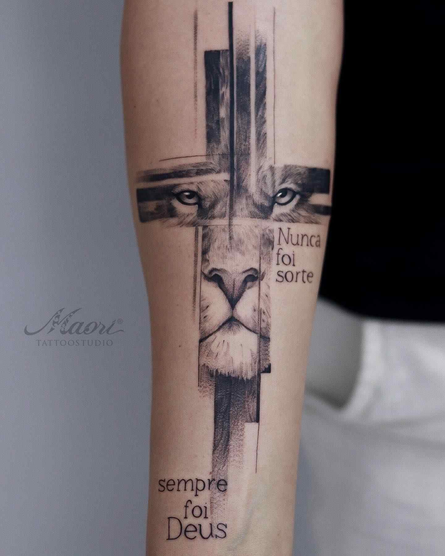modern-minimal-cross-lion-tattoo