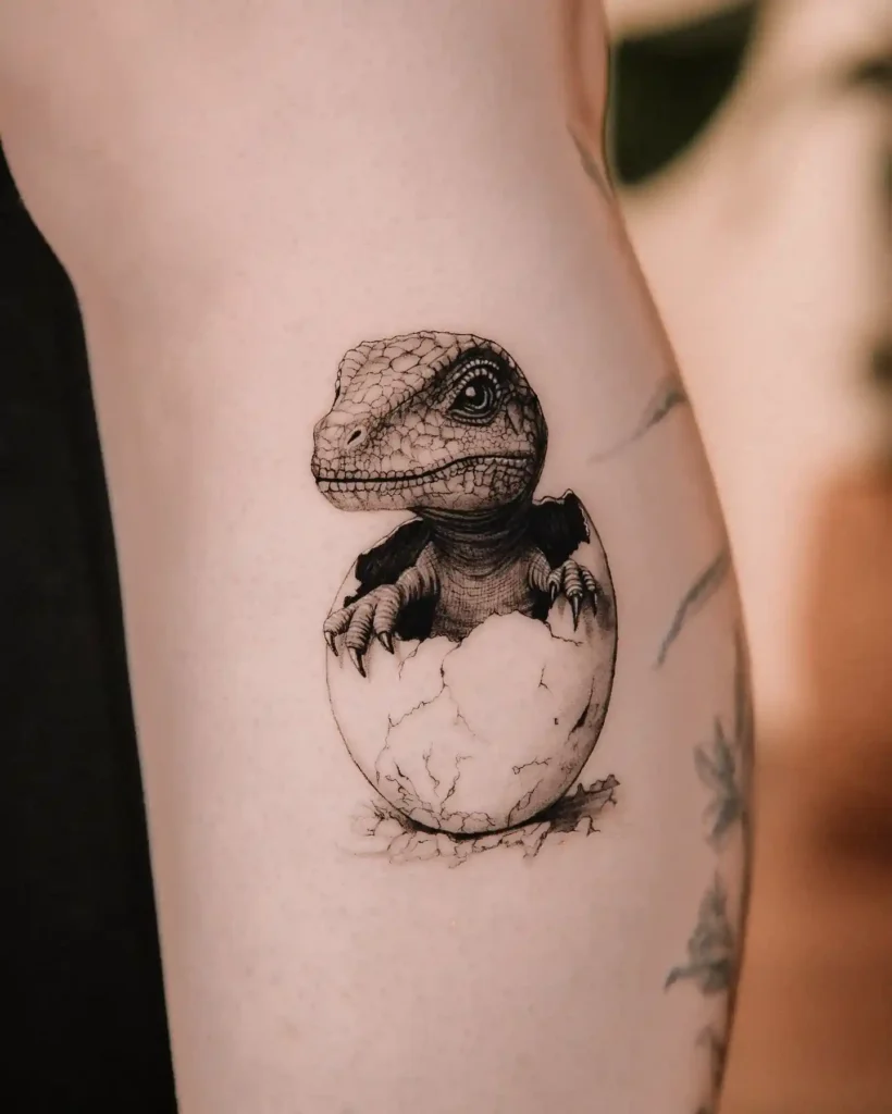 Baby Dinosaur Hatching Tattoo