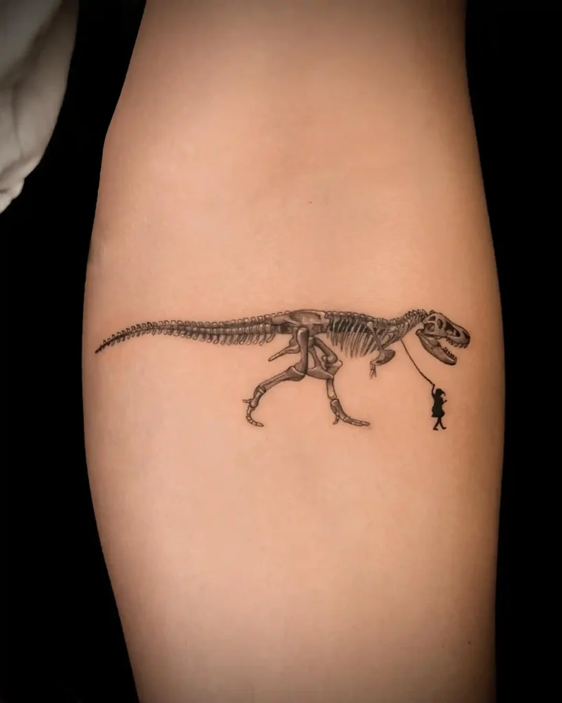 T-Rex Skeleton Walked by a Tiny Human Tattoo