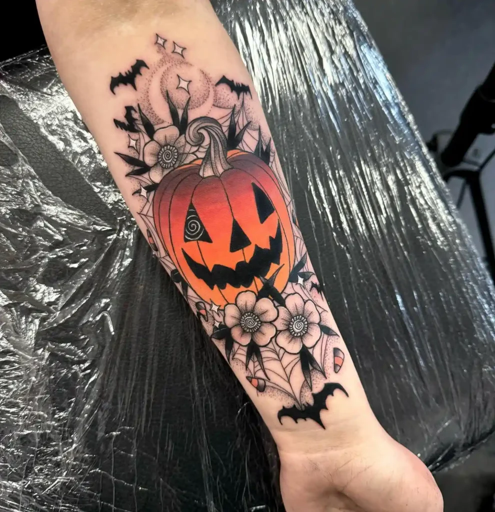 Playful Jack-O'-Lantern Tattoo with Floral Accents