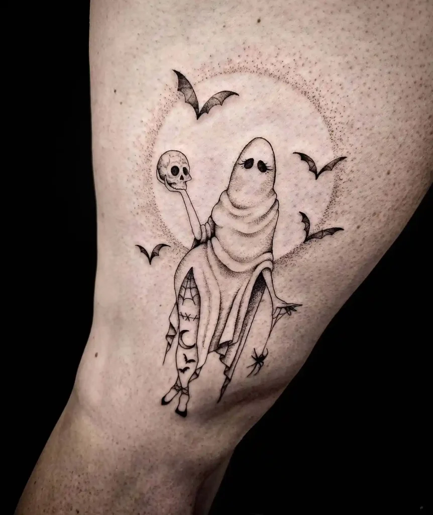 Haunting Bat & Witch Holding Skull Tattoo