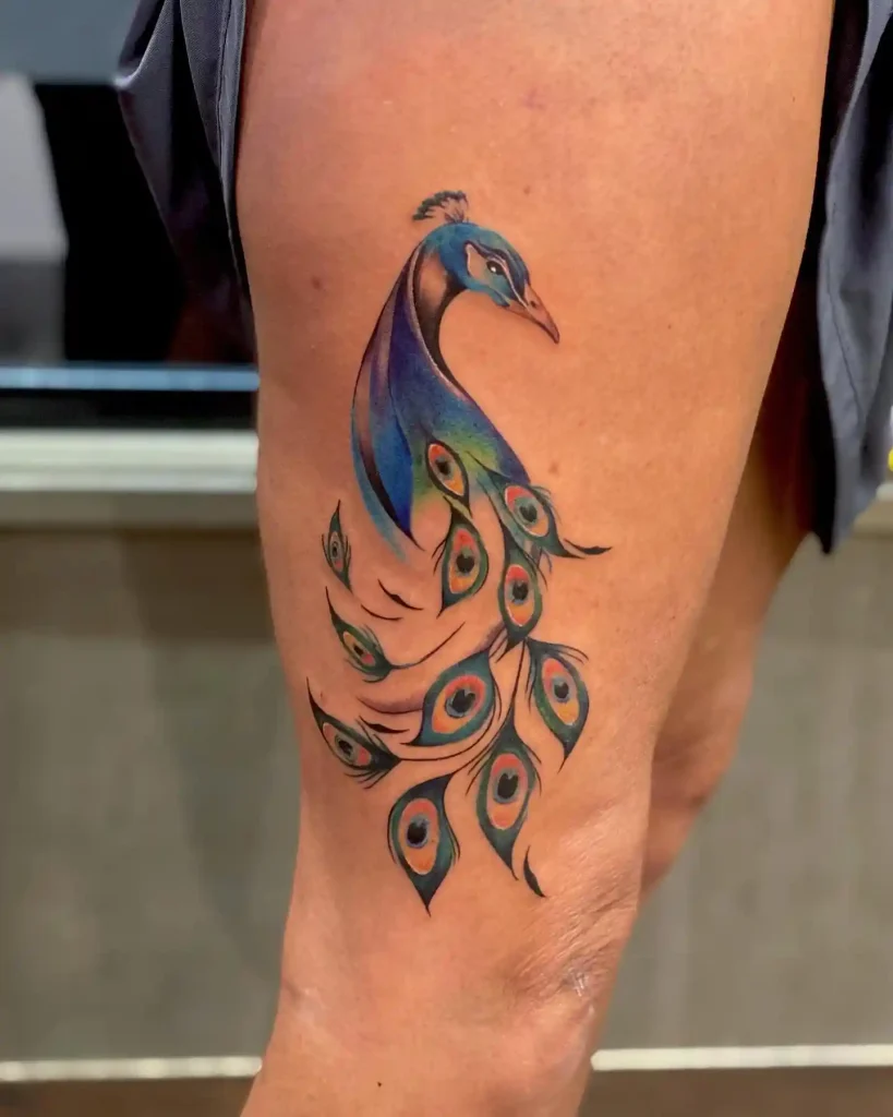 Flowing Watercolor Peacock Tattoo