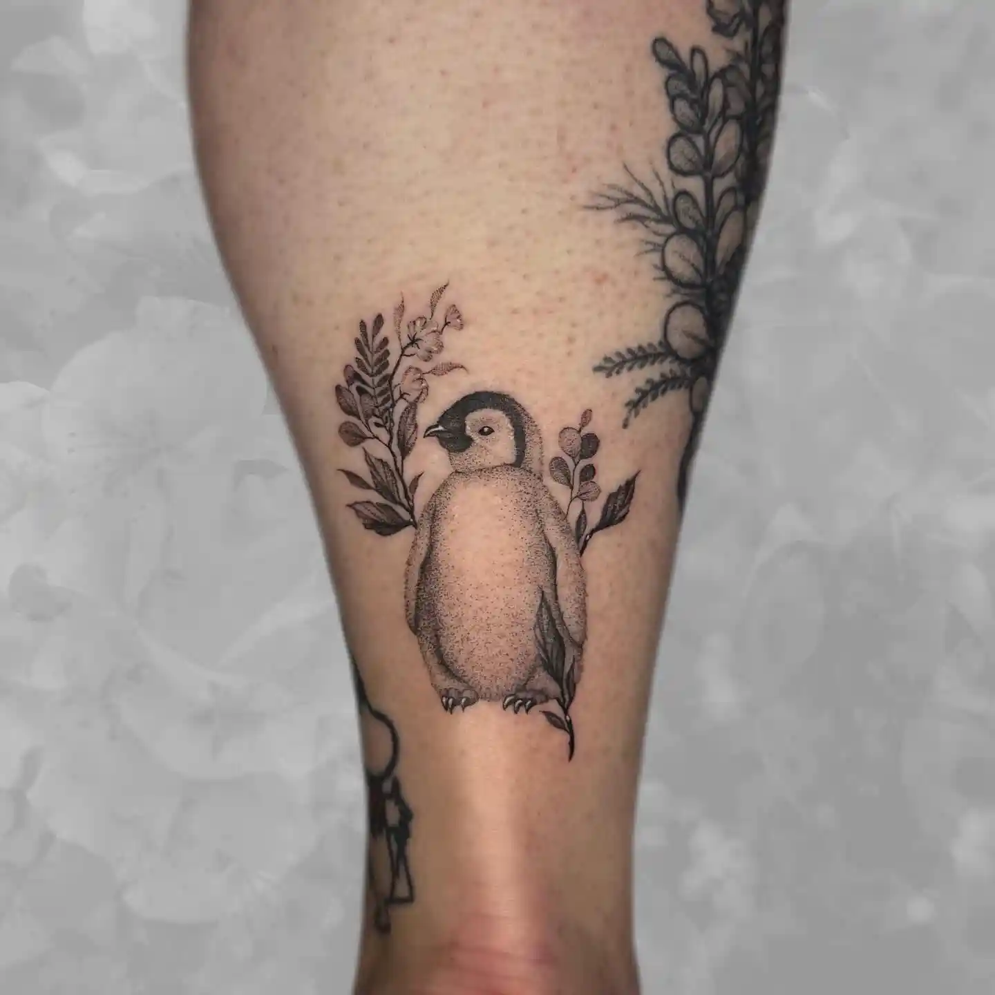 Botanical Baby Penguin Tattoo