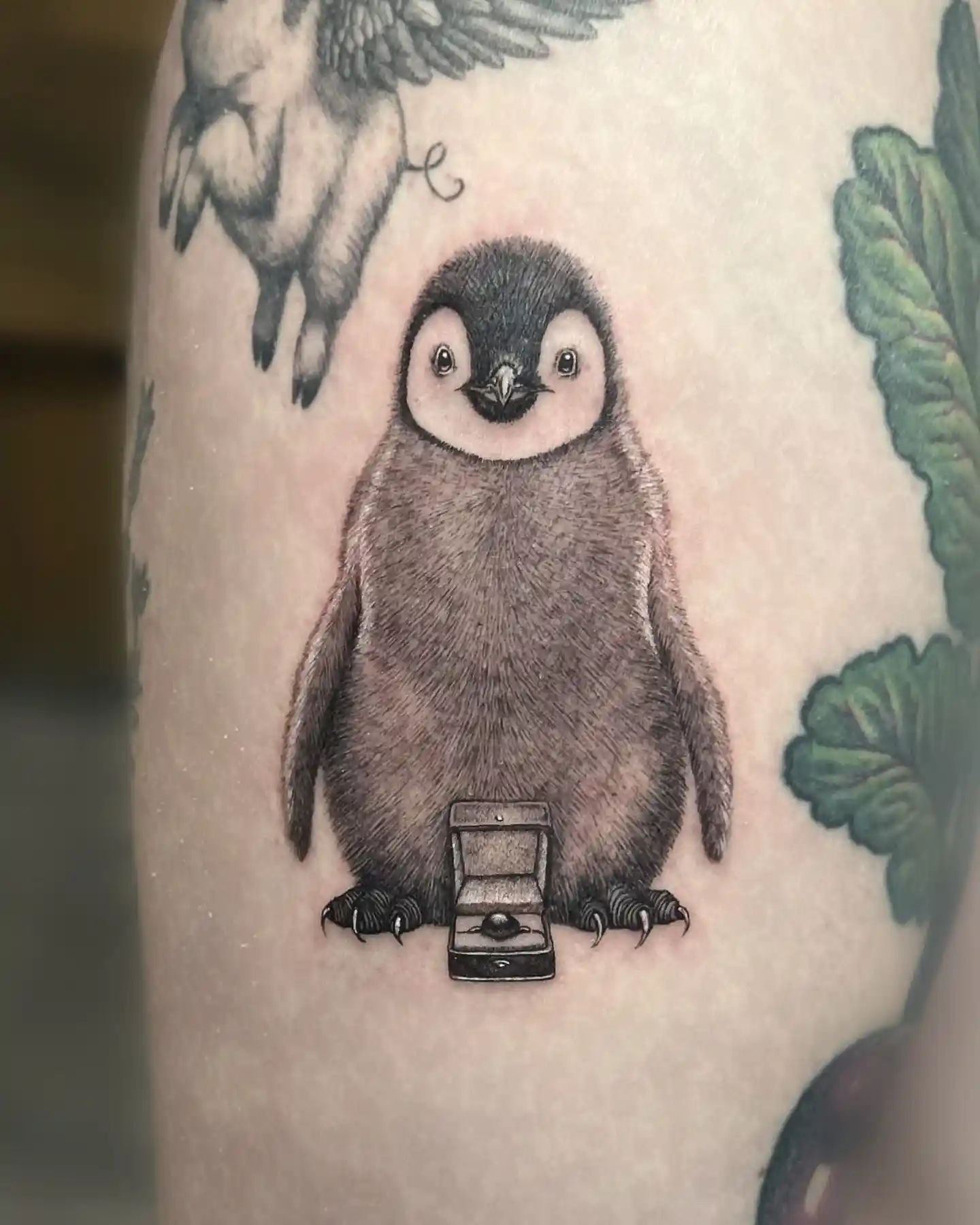 Adorable Penguin Proposal Tattoo