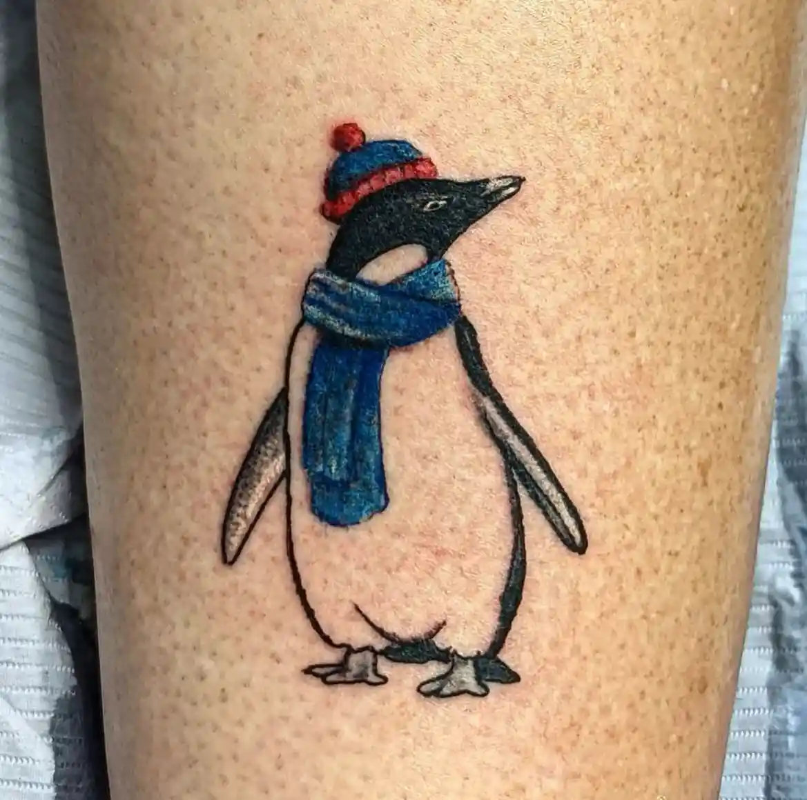 Cozy Winter Penguin Tattoo Wearing Hat and Muffler