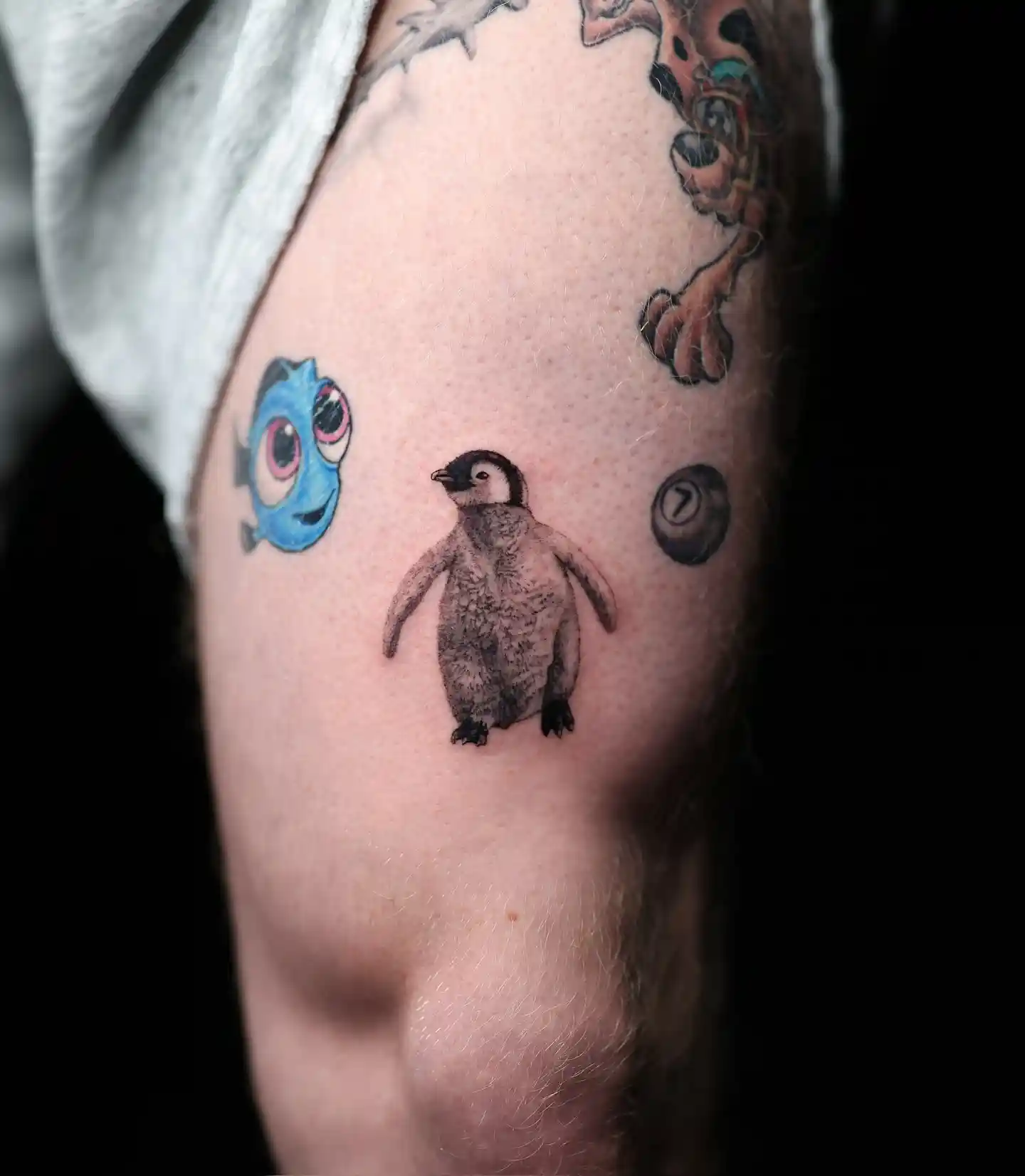 Hyper-Realistic Baby Penguin Tattoo