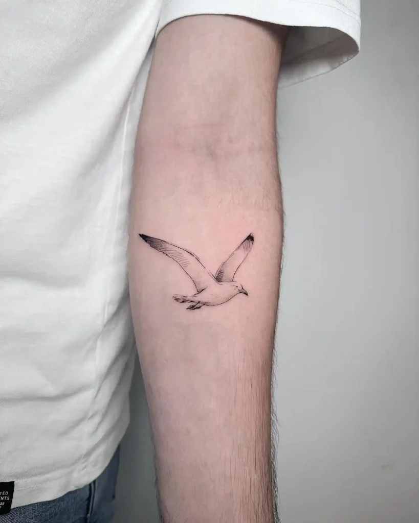 Fine-Line Flying Seagull Tattoo