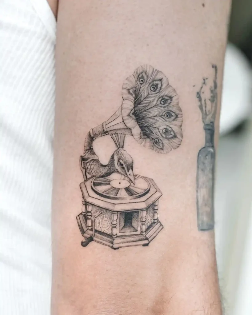 Surreal Peacock Embedded Gramophone Tattoo