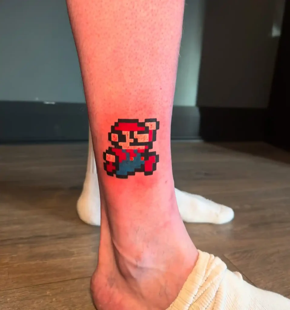 Pixelated Tanooki Mario Tattoo on Ankle