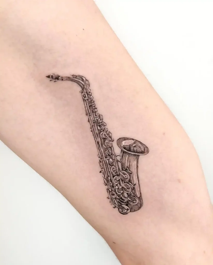 Ornate Saxophone Tattoo on Arm