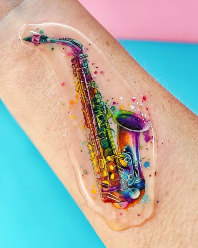 Rainbow Watercolor Saxophone Tattoo