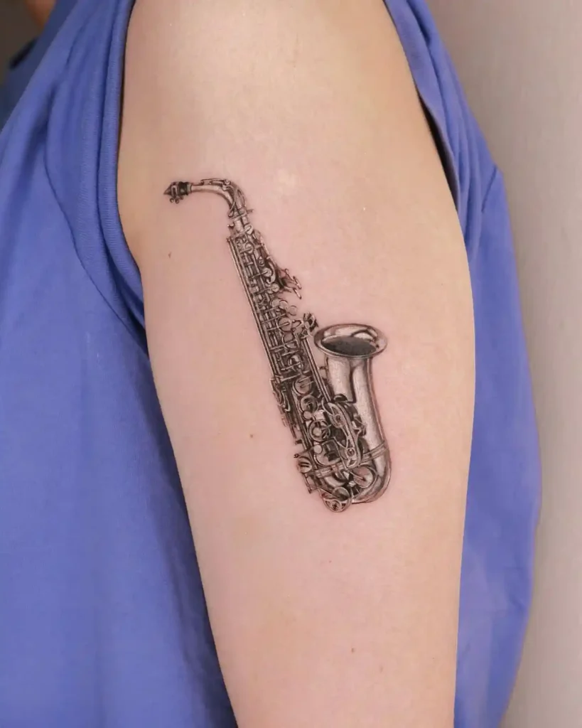 Realistic Black and Grey Saxophone Tattoo