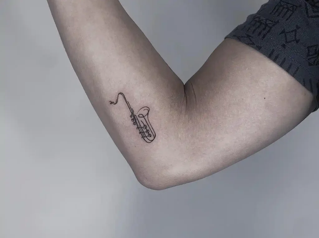 Minimalist Single Line Saxophone Tattoo