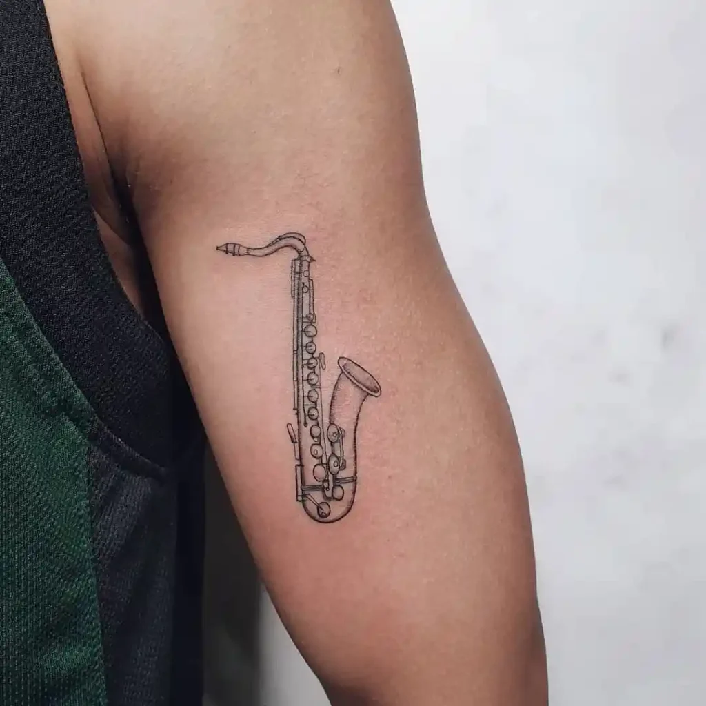 Fine-line Saxophone Tattoo