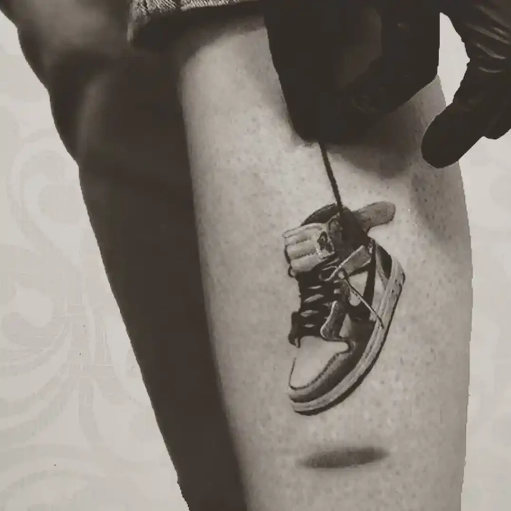 Dangling Nike Shoe Tattoo