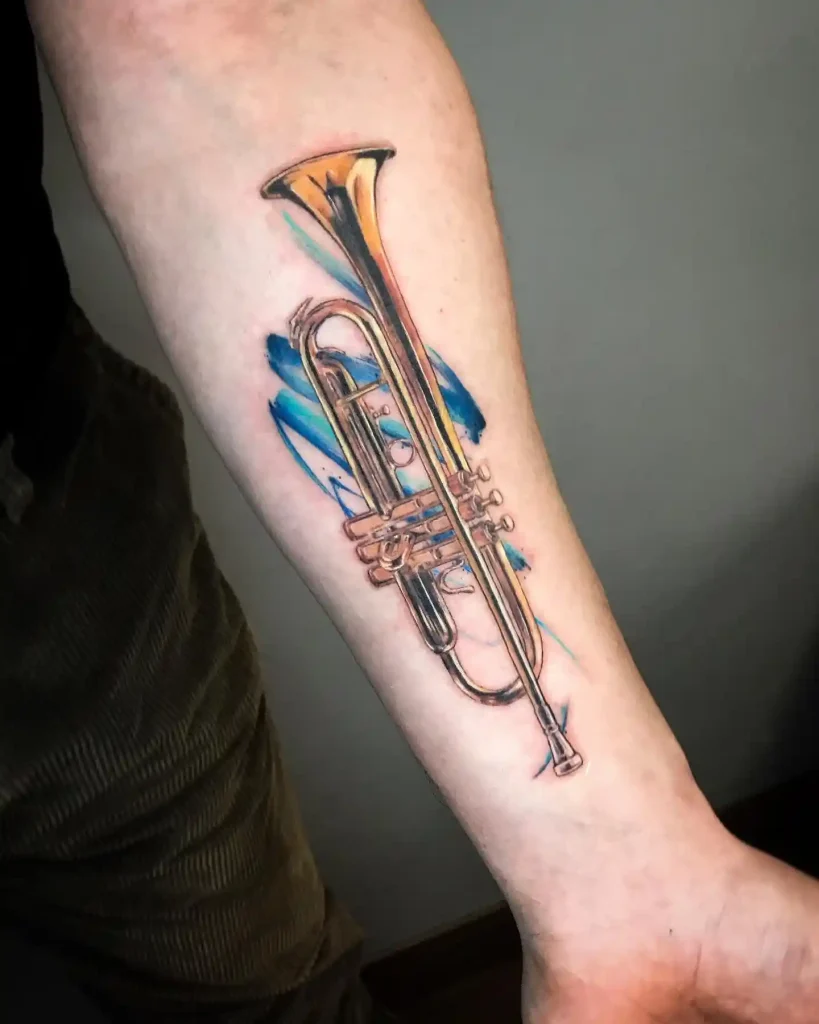 Trumpet Tattoo with Blue Watercolor on Forearm
