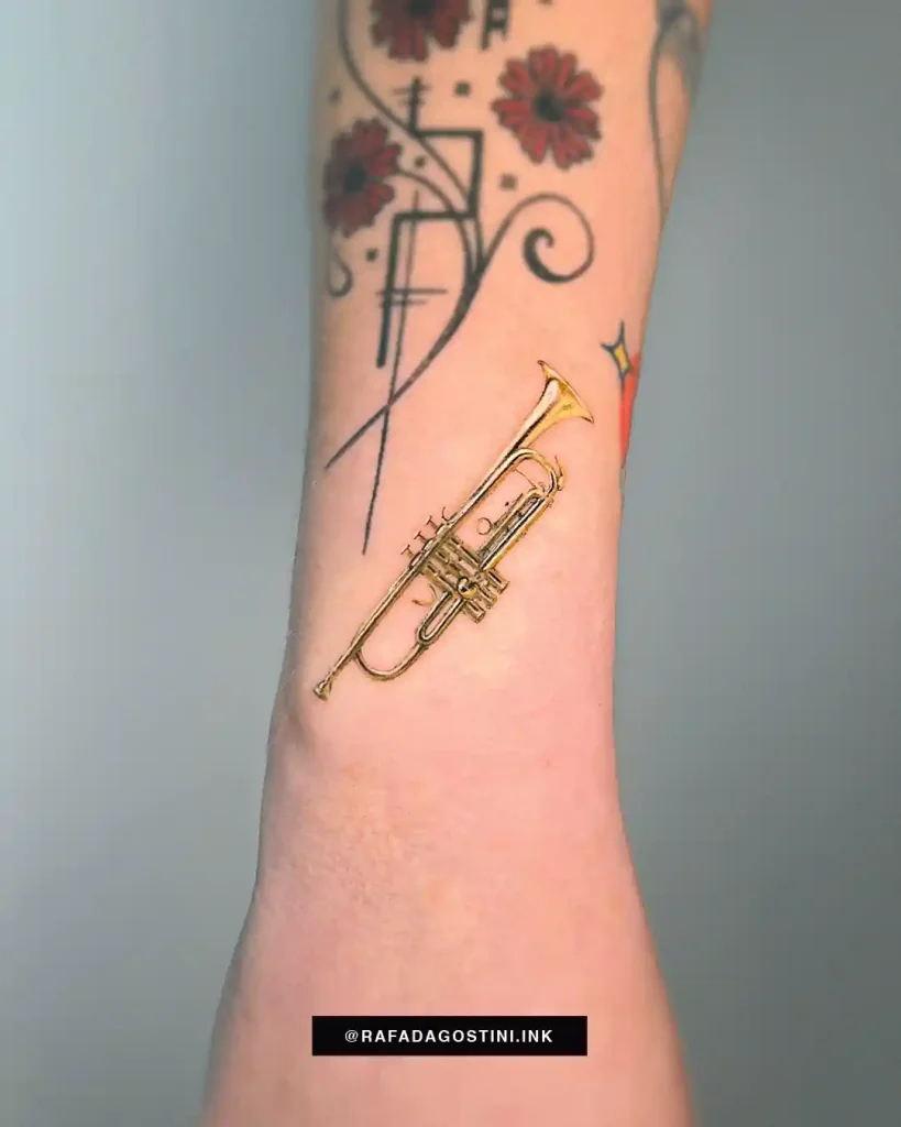 Small Realistic Golden Trumpet Tattoo