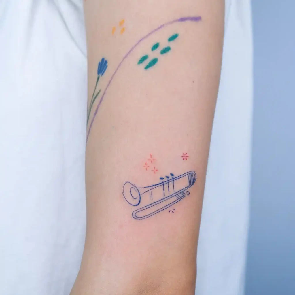Child-like Trombone Tattoo on Upper Arm