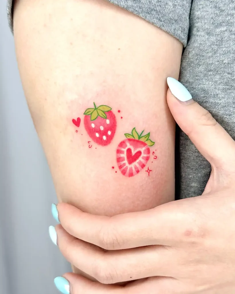 Dual Strawberry Tattoo on Upper Arm