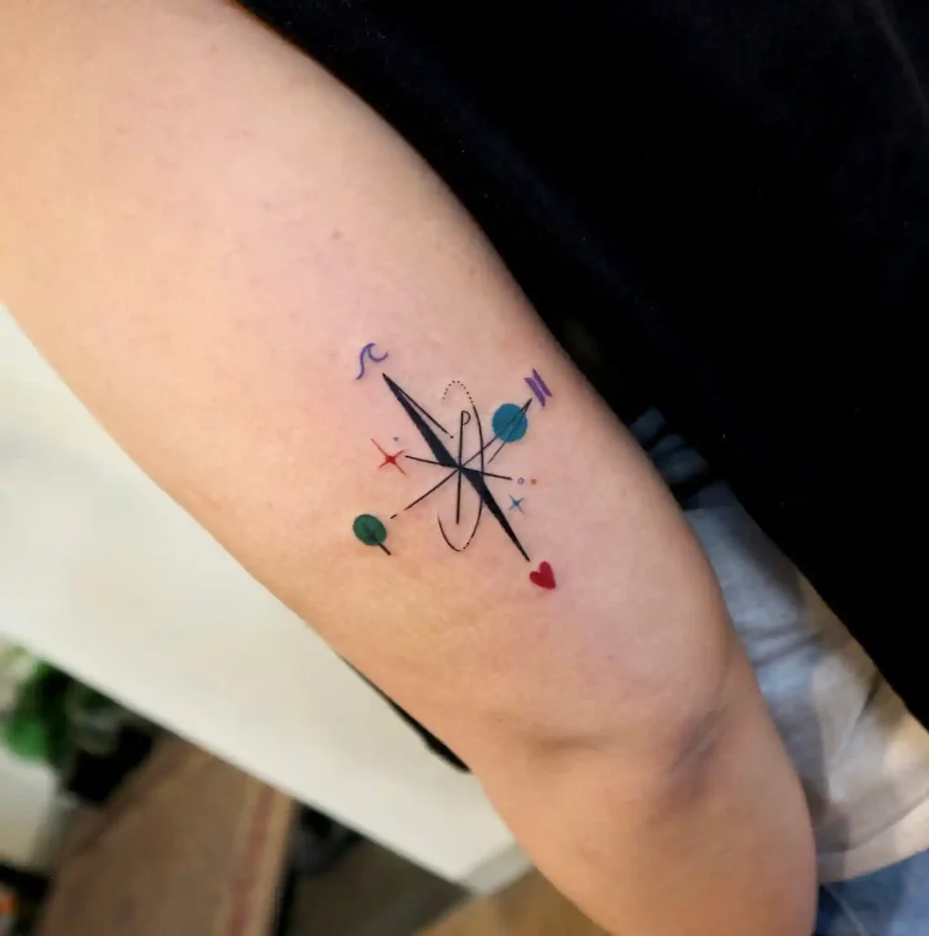 Minimalist Colorful Icon Compass on Inner Bicep