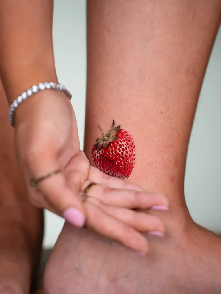 Realistic Strawberry Tattoo on Ankle