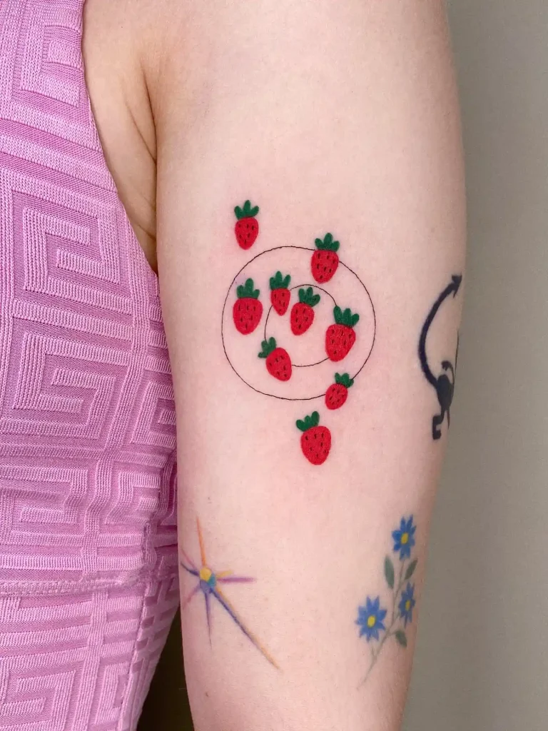 Strawberry Cluster Tattoo on Upper Arm