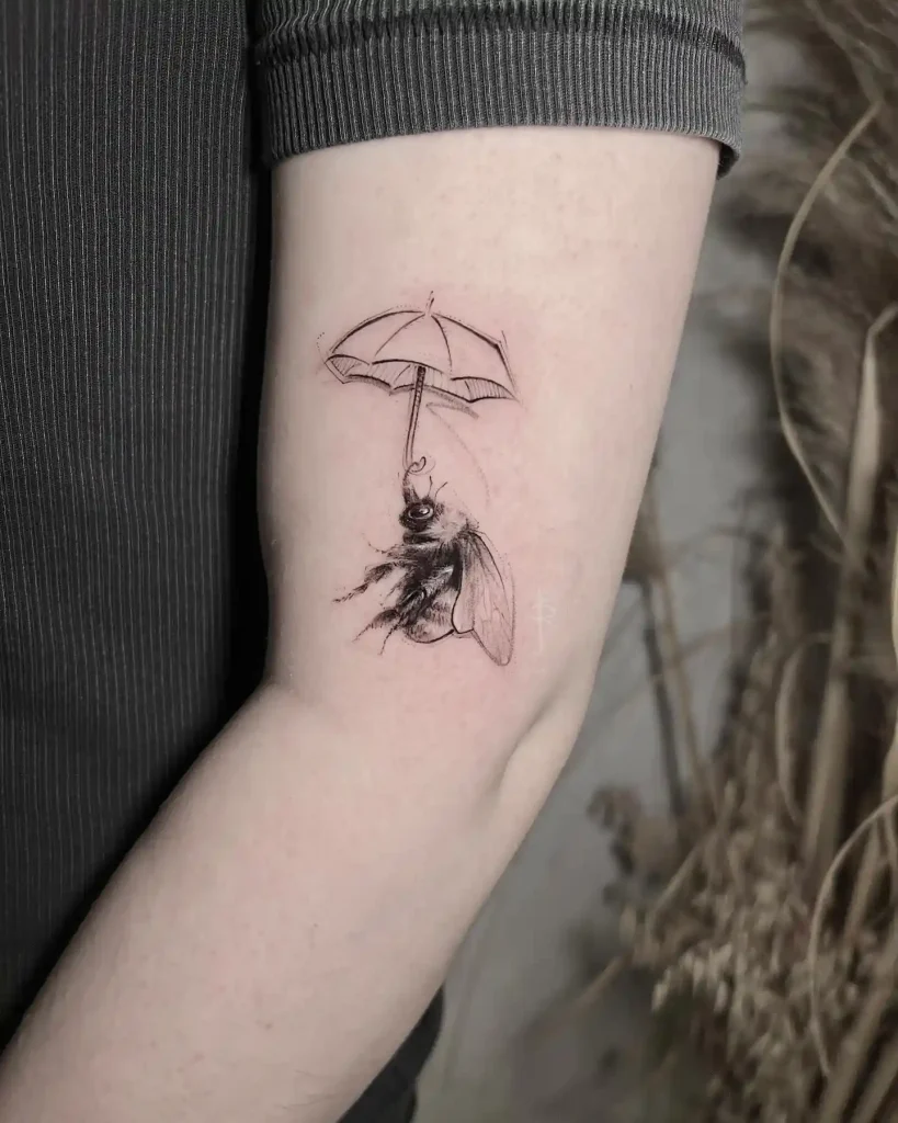 Bumblebee Holding Umbrella on Upper Arm