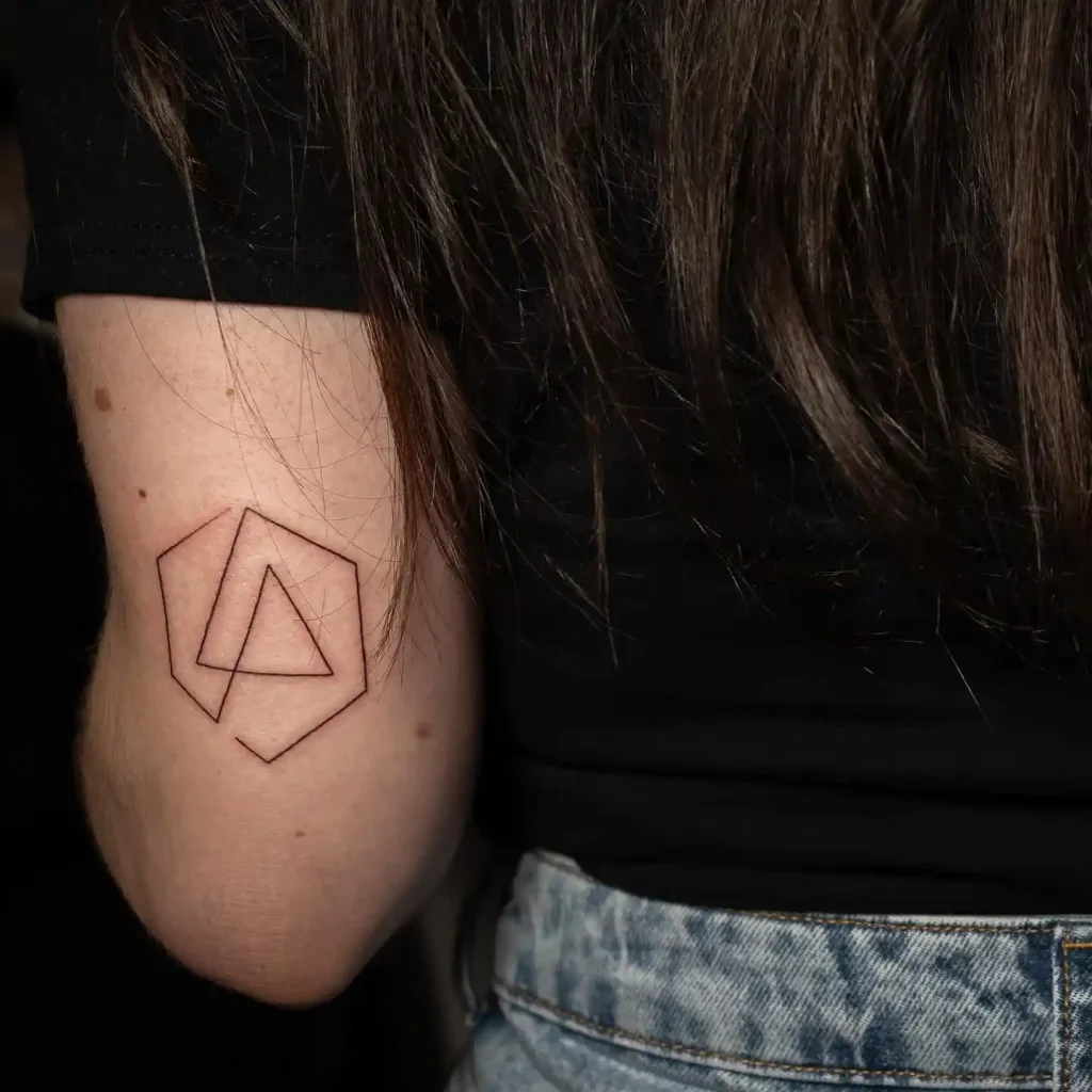 Fine Line Hexagon Logo on Back of Arm