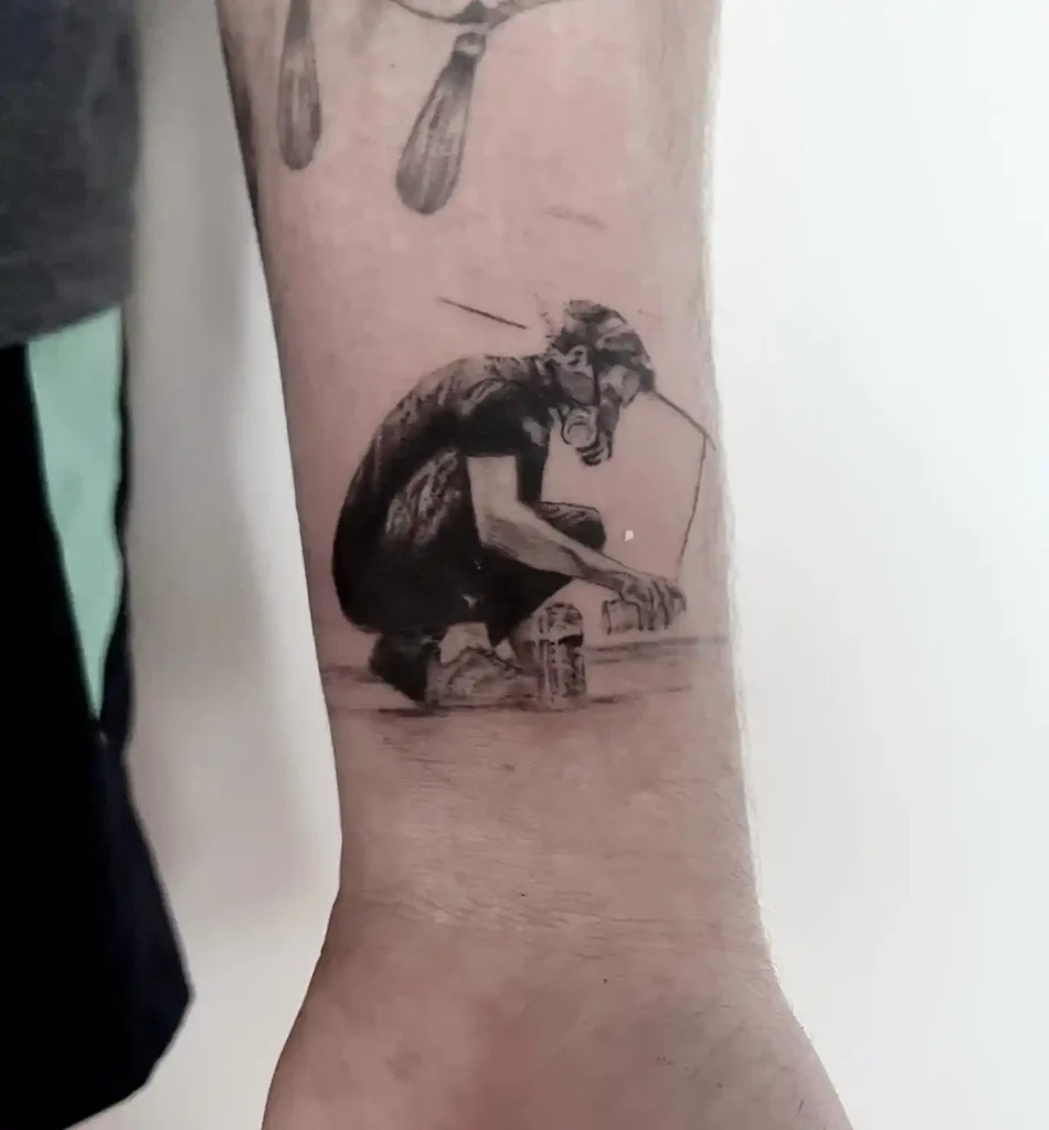 Meteora Artist Figure on Inner Forearm