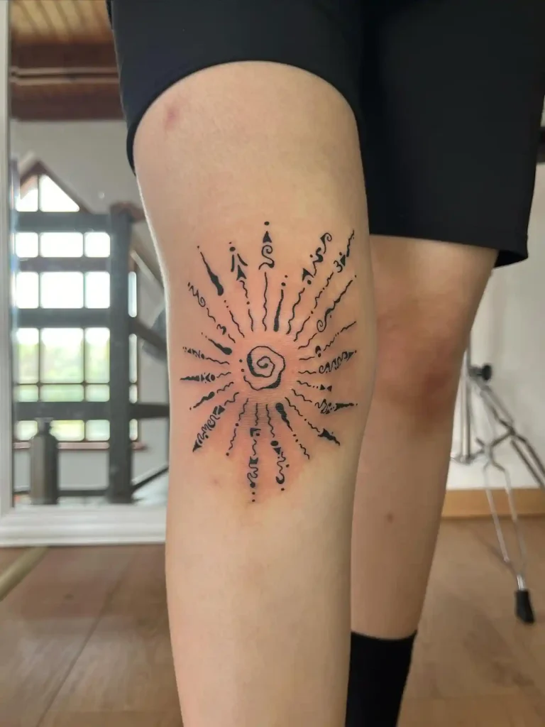 Abstract Script Sunburst on Knee