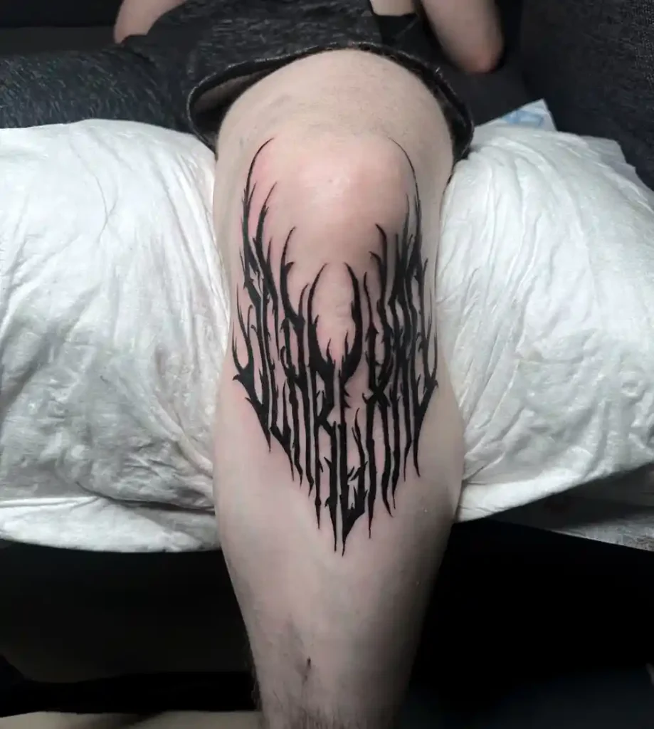 Black Abstract Thorn Design on Knee
