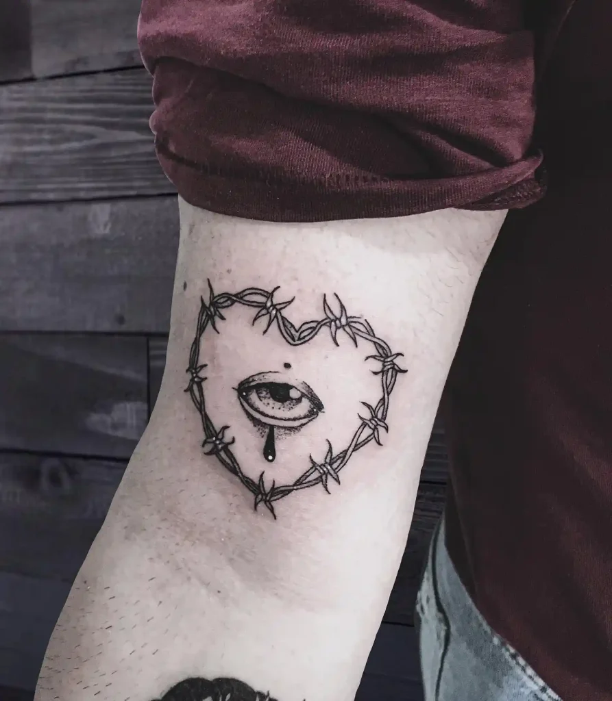 Crying Eye in Barbed Wire Heart on Forearm