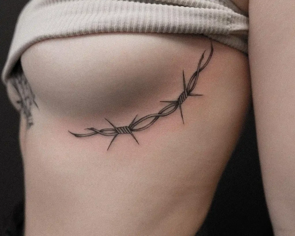 Curved Barbed Wire Strand on Rib Cage