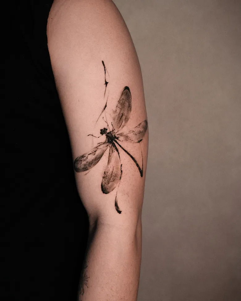 Dragonfly Tattoo with Painterly Texture on Arm