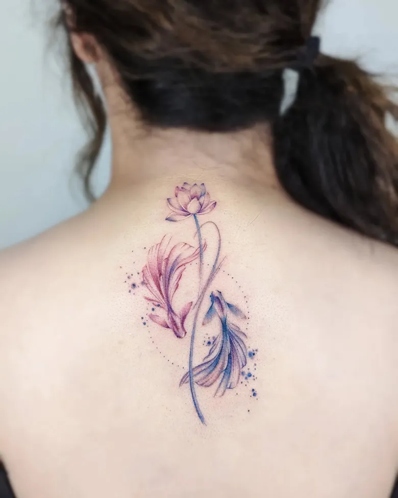 Elegant Koi Fish and Lotus Spine Tattoo