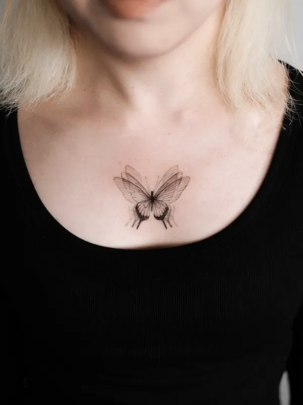 Minimal Fine Line Butterfly Chest Tattoo