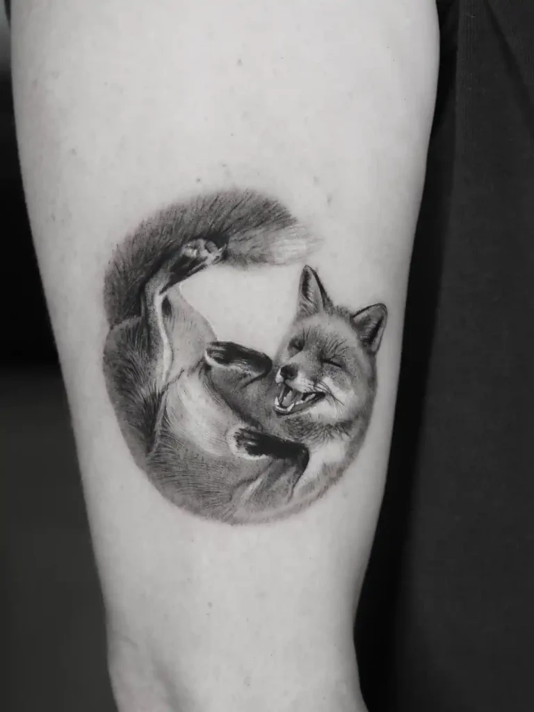 Playful Fox Curled in a Circle on Inner Arm
