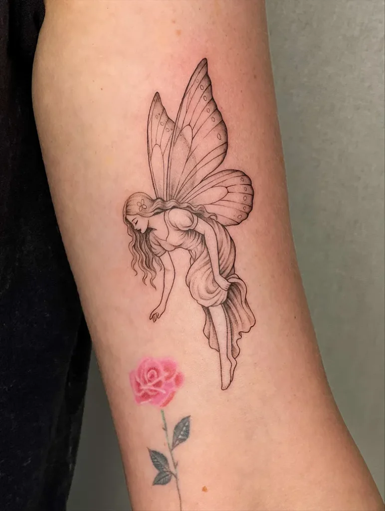 Romantic Fairy Tattoo with Flowing Wings