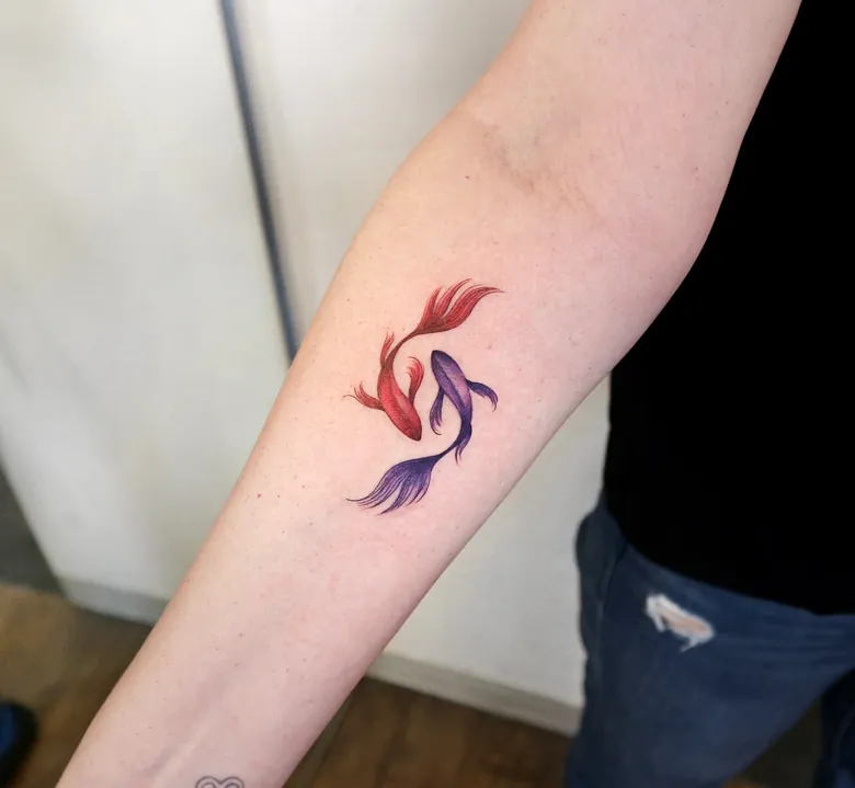 Small Red and Purple Yin Yang Koi Tattoo on Forearm