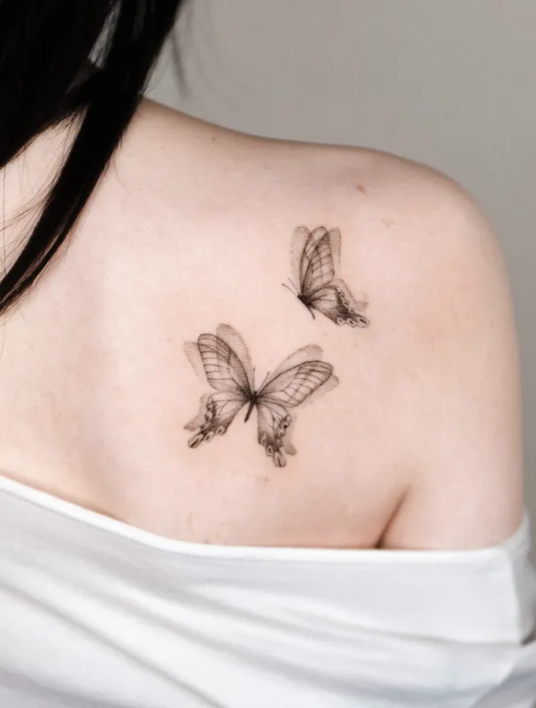 Soft Blackwork Butterfly Shoulder Tattoo