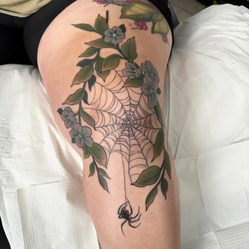 Spider Web Floral Scene on Knee